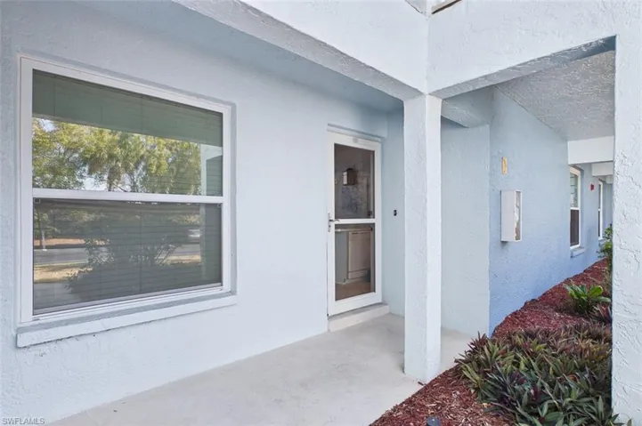 View of exterior entry featuring stucco siding