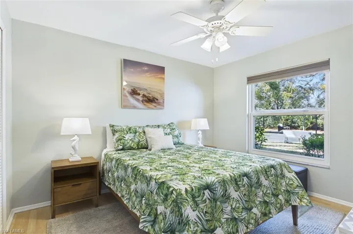 Bedroom featuring light wood-style floors and a ceiling fan