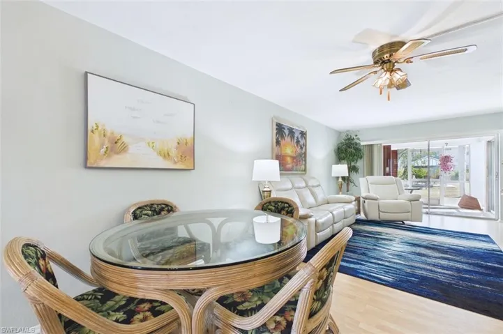 Dining room with a ceiling fan and wood finished floors