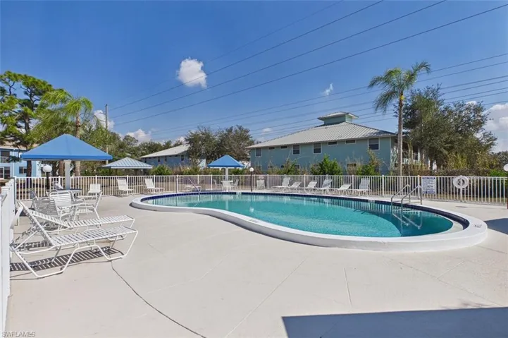 Community pool featuring a patio and a gazebo