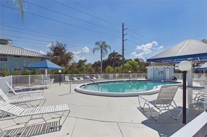 Community pool featuring a patio and a gazebo