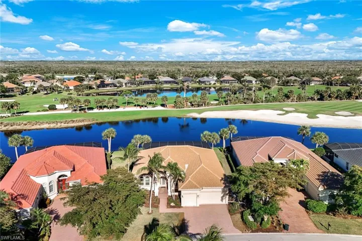 Drone / aerial view with view of golf course and a water view