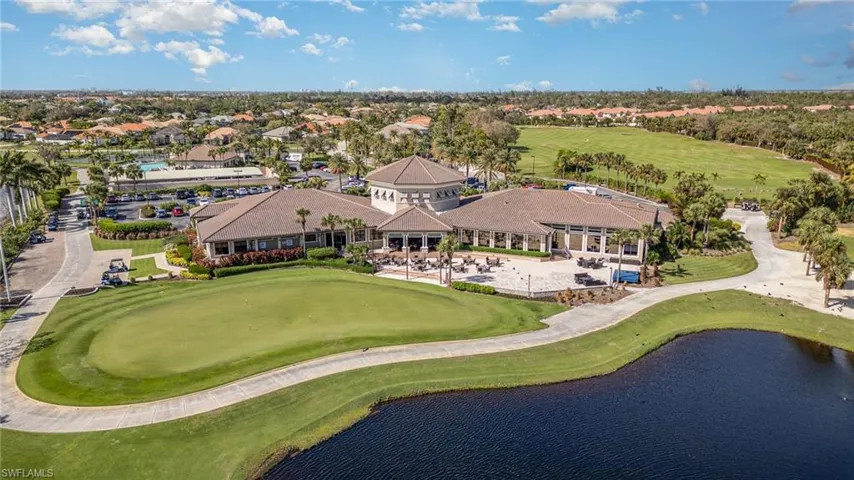 Drone / aerial view with a water view and golf course view of Clubhouse