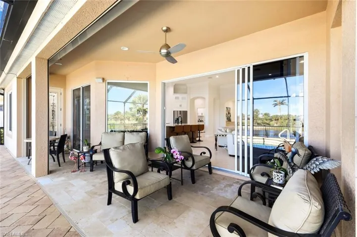 View of patio with outdoor lounge area and a ceiling fan