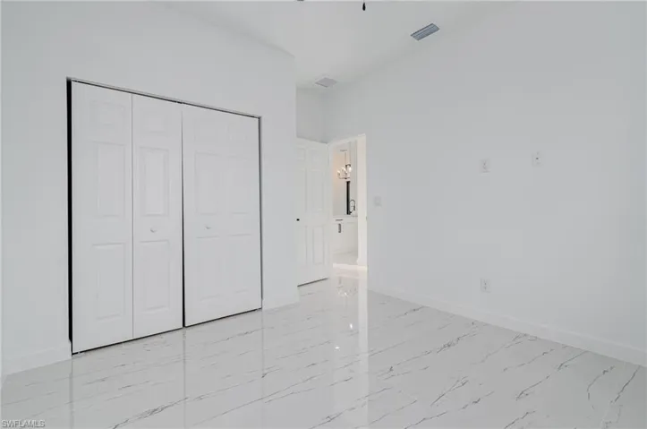 Unfurnished bedroom with a closet