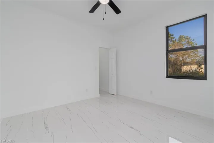 Empty room featuring ceiling fan