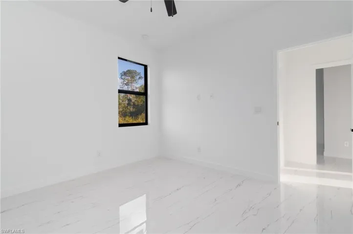 Empty room featuring ceiling fan