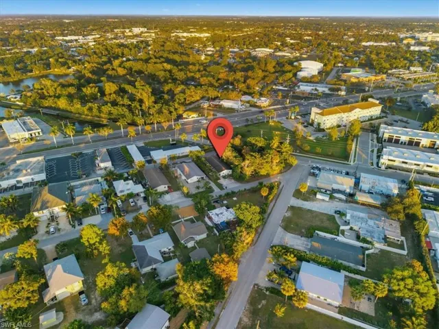 Aerial overview of property's location featuring nearby suburban area