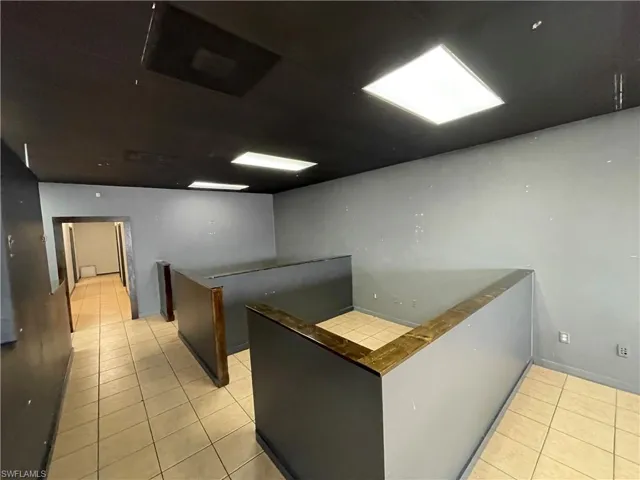 Kitchen with light tile patterned flooring