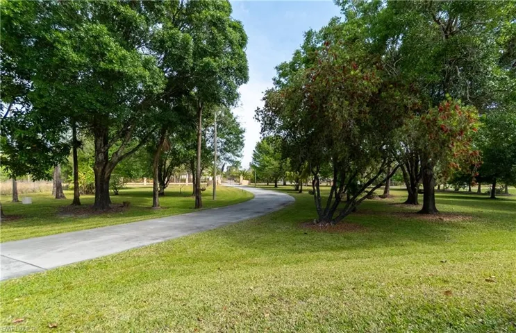 View of community featuring a lawn