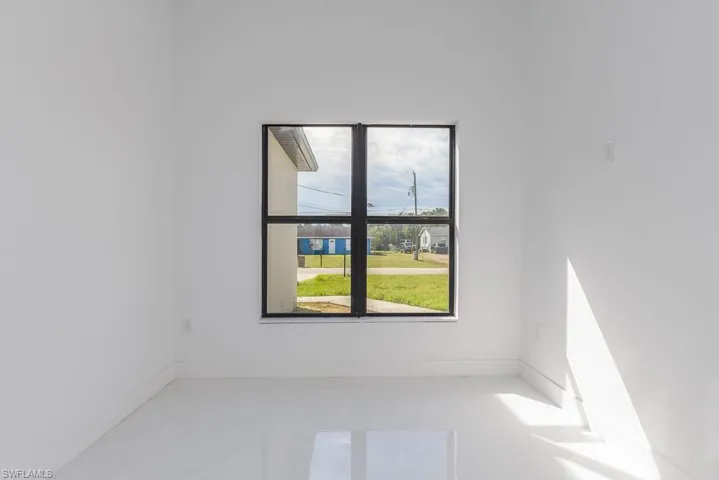Empty room with marble finish floor and baseboards