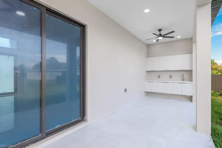 View of patio with a ceiling fan