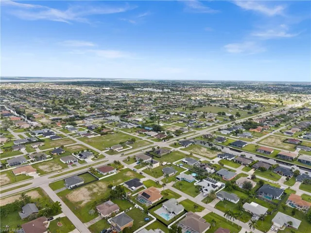 Aerial view of property's location featuring nearby suburban area