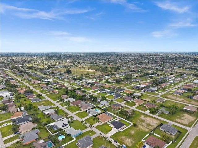View of property location with nearby suburban area