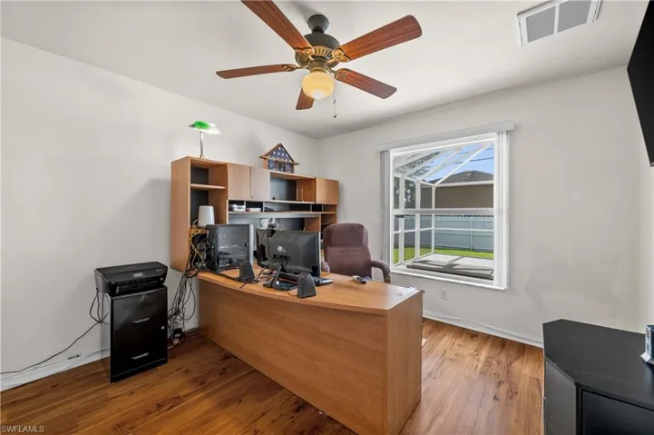 Office space featuring light wood finished floors and ceiling fan