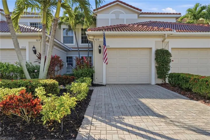 Mediterranean / spanish house featuring stucco siding, decorative driveway, an attached garage, and a tile roof