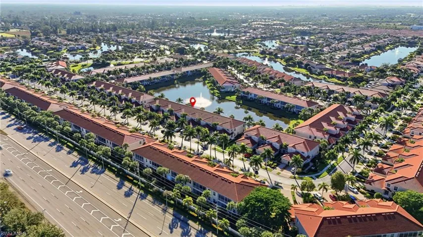Aerial perspective of suburban area with a large body of water