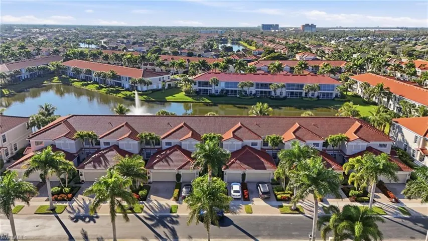 Aerial view of a large body of water and apartment complex / building