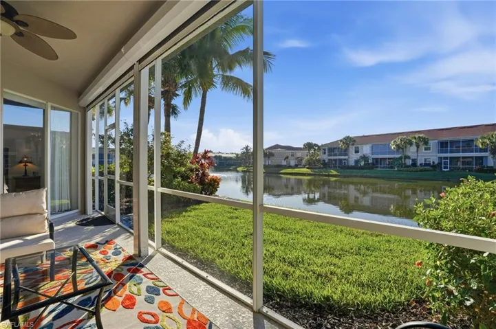 Unfurnished sunroom featuring a water view