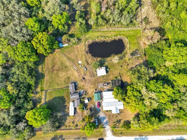 Aerial view of property's location with a nearby body of water