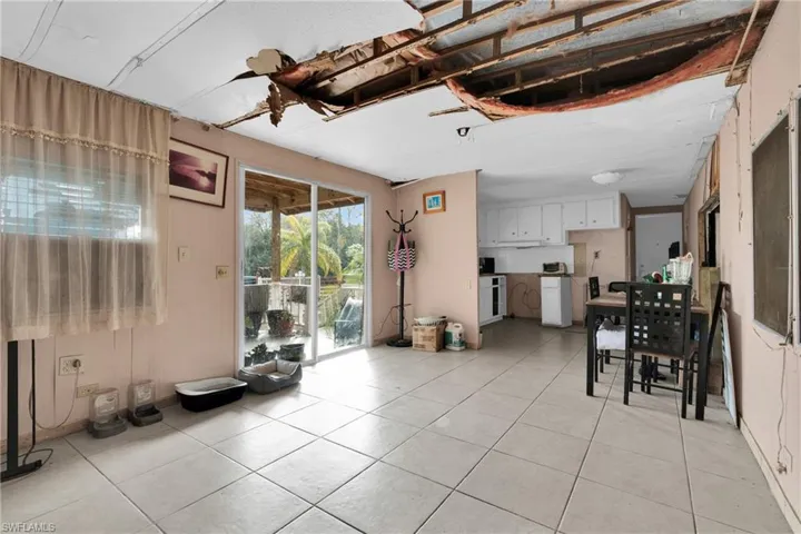 Living area featuring light tile patterned flooring