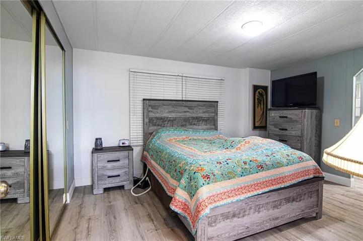 Bedroom with wood finished floors
