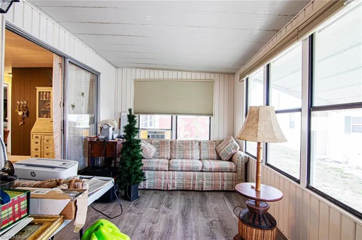Sunroom with wood finished floors