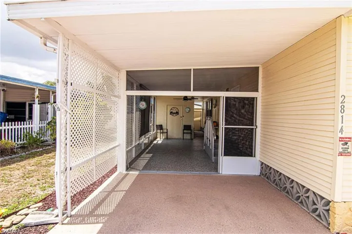 View of patio with a carport