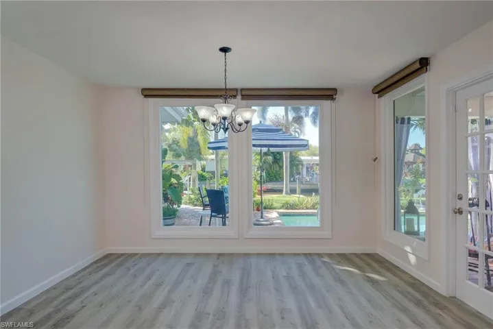 FORMAL DINING AREA WITH PICTURE WINDOWS!  IMPACT RESISTANT WINDOWS!  FRENCH DOOR TO LANAI!