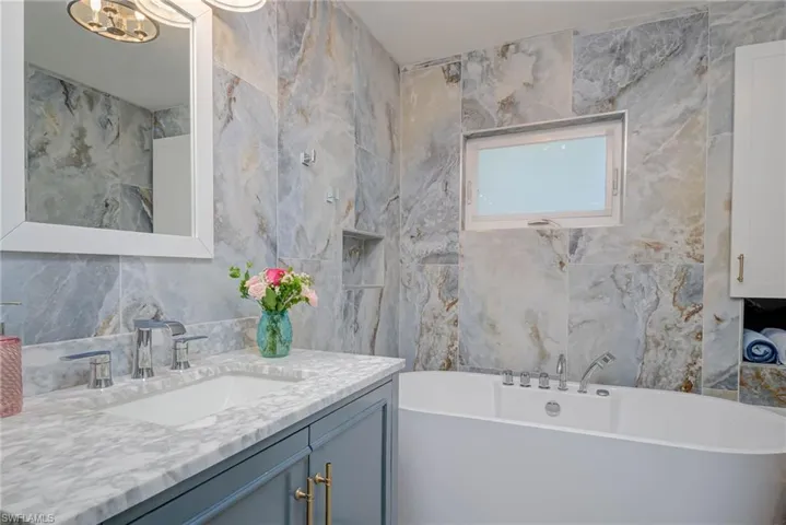 GUEST BATH WITH STAND ALONE TUB.  PLENTY OF BUILT-IN STORAGE.
