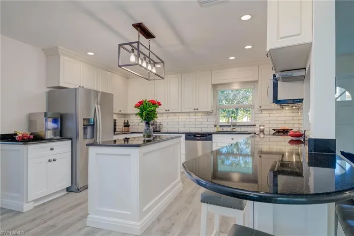 GRANITE COUNTER TOPS, WHITE SUBWAY TILE, LED LIGHTING