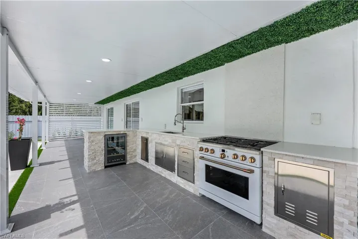 View of patio / terrace with an outdoor kitchen and wine cooler