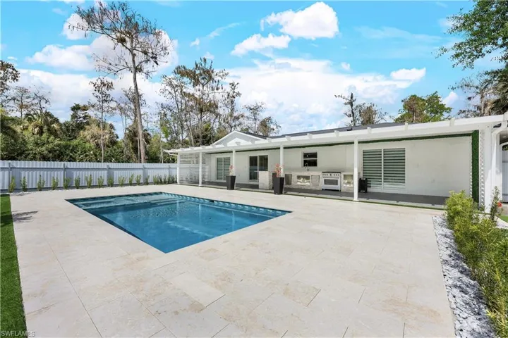 View of swimming pool with patio surround