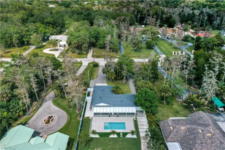 View of property location featuring a heavily wooded area