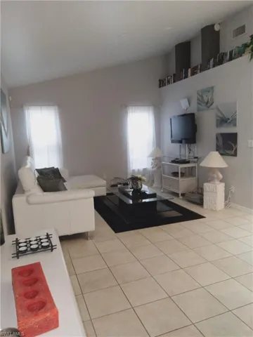 Living room featuring light tile patterned floors