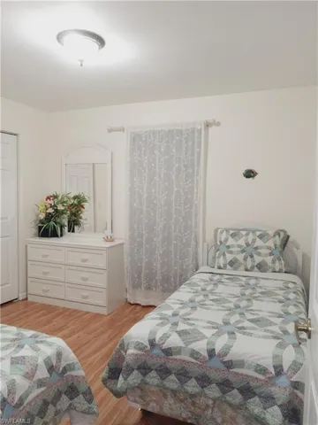 Bedroom with light wood-style floors