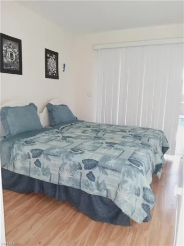 Bedroom with wood finished floors