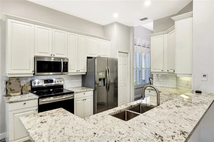 Sleek White Quartz Countertops and Modern Cabinetry