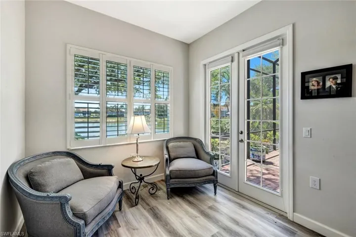 Relaxing Sitting Area with French Doors Leading to Sunny Lanai