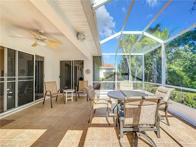 Sunroom / solarium featuring ceiling fan