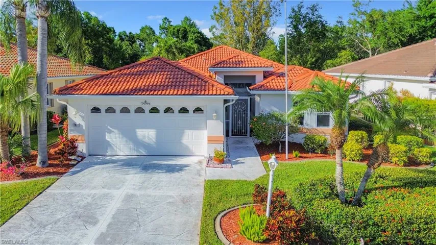 Mediterranean / spanish-style house with a garage