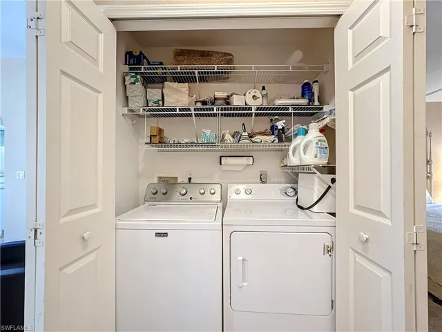 Washroom with hookup for a washing machine, washer and clothes dryer, and electric dryer hookup