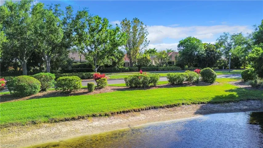 View of nearby features with a lawn