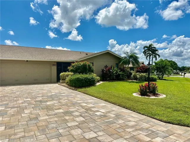 Beautiful paver driveway can accomodate several vehicles.