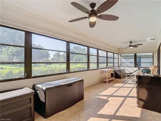 Sunroom with lovely views of the lush landscaping.