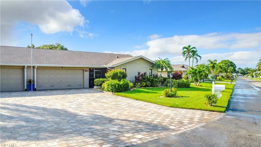 Beautiful paver driveway can accommodate several vehicles.