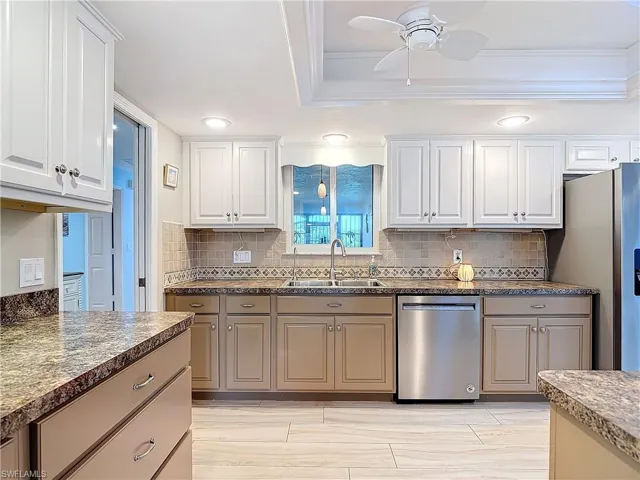 Kitchen offers plenty of cabinets for storage.