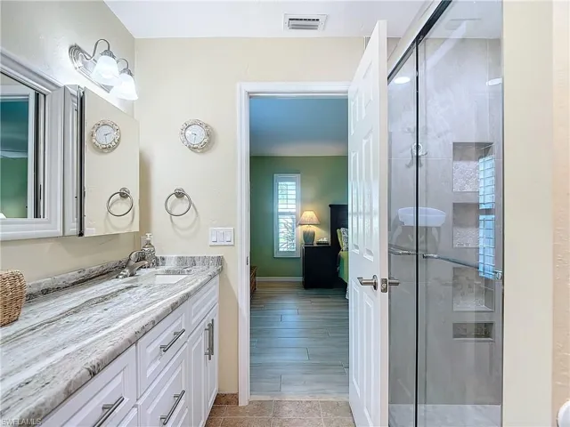 Stunning granite vanity with double sinks.