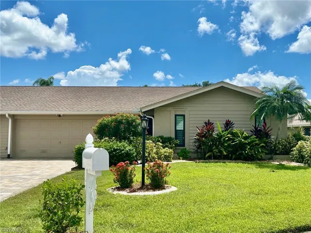 Surrounded by lush, tropical landscaping