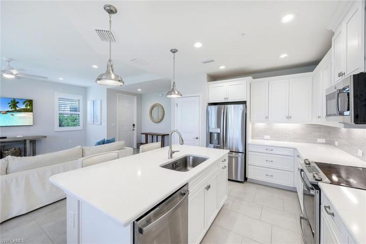 Kitchen with white shaker cabinetry